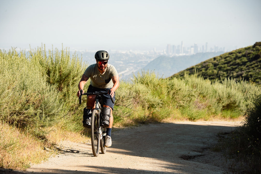 Rider on a Pure Cycles Adventure AL on a gravel trail above the city